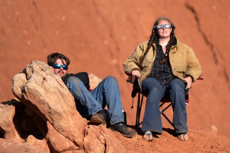 A couple with sunglasses watches the eclipse at Capitol Reef National Park in Utah.