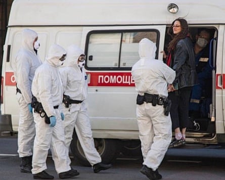 Rita Flores being escorted into a van by Russian security services