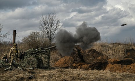 Ukrainian servicemen fire with a 105mm howitzer towards Russian positions near the city of Bakhmut.