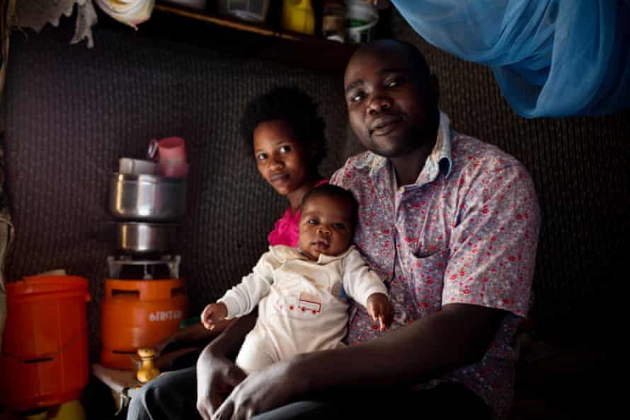 Jacqueline and James Onyango with their baby Wesley at their home in Kibera
