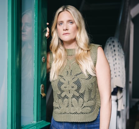 Romola Garai at a front door