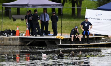 Police divers search Yerrabi Pond in Canberra, yesterday