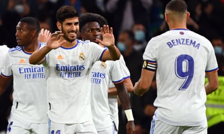 Marco Asensio celebrates his hat-trick and goes to his Real Madrid teammate Karim Benzema.