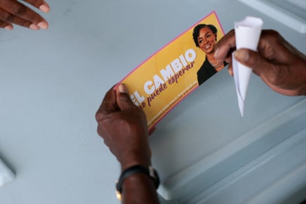 hands hold a campaign brochure
