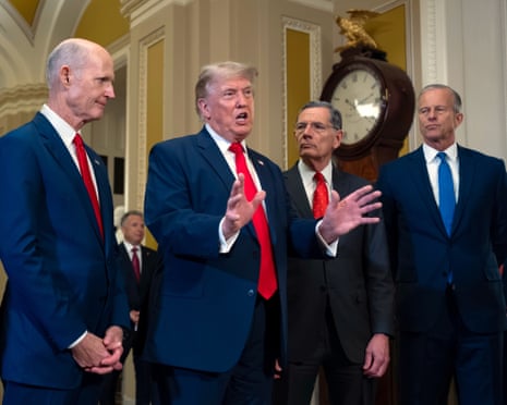 Donald Trump, joined from left by senators Rick Scott, John Barrasso and Senate majority leader John Thune, speaks to reporters as he finishes his lunch meeting with Republican senators at the US Capitol on 24 June.