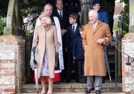 Queen Camilla and King Charles with members of the royal family behind them