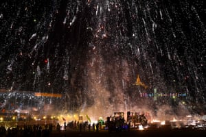 Mandalay, Myanmar. Fireworks explode over revellers during the Tazaungdaing light festival that is celebrated to mark the end of the rainy season