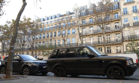 Large cars parked in a Paris street