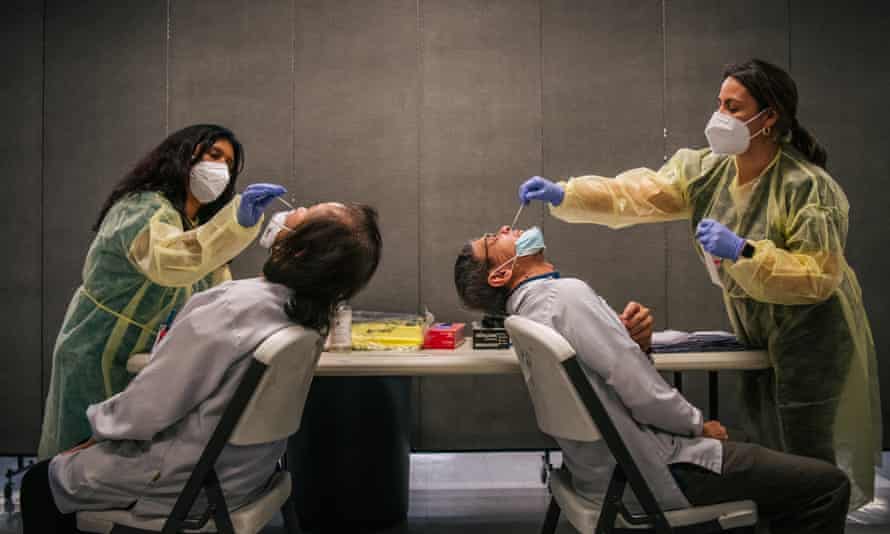 Agency photographer of the year – 2021 shortlist | World news 35 Genview Diagnosis medical assistants Crystal Leyva and Keitia Perez administer COVID-19 sampling tests, to laboratory technicians, at Foxconn Assembly on 13 Augustin Houston, Texas