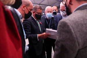 Alok Sharma (centre left) takes the amended text to Frans Timmermans (centre right) and other key ministers across the plenary floor in order to find common ground moments before the final plenary