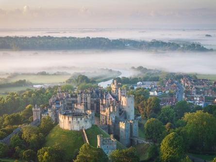 Castle and river on a misty morning.