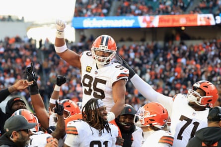 Myles Garrett celebrates with teammates after breaking the NFL’s single-season sack mark in January.