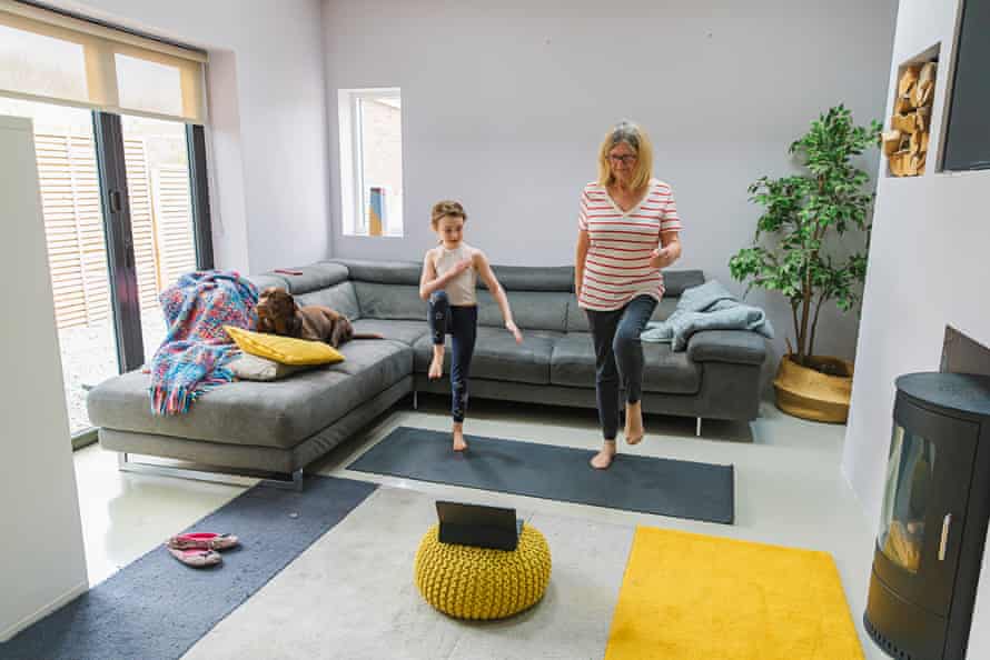 Woman and child exercising indoors