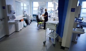 A dementia patient being looked after in the intensive care unit of an NHS hospital