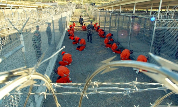 Military Police guard Taliban and al Qaeda detainees, January 11, 2002 Guantanamo Bay, Cuba