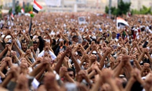 Anti-government protesters shout slogans during a rally in Sana'a in September 2011