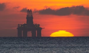 The sun rises by a redundant oil platform moored off Kirkcaldy