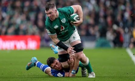 Peter O’Mahony tackled by Italy’s Paolo Garbisi in 2022
