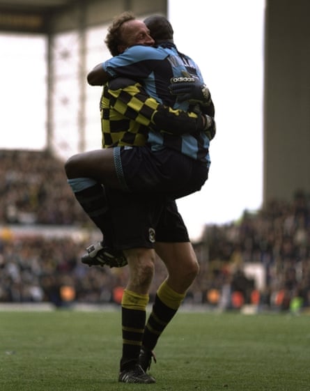 Steve Ogrizovic celebrates with Paul Williams after Coventry survive on the final day at Tottenham in 1997.