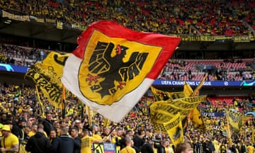 Dortmund fans wave their flags inside the stadium