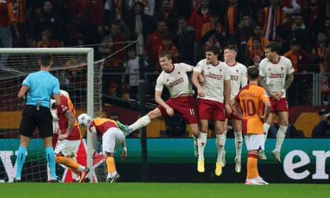 Galatasaray’s Hakim Ziyech scores their first goal from a free kick against Manchester United.