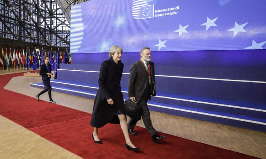 Theresa May and Tim Barrow, UK permanent representative to the EU, arrive for the first day of the European Union summit in Brussels on Thursday.