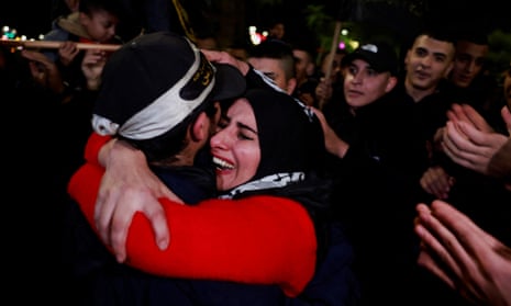 A Palestinian prisoner hugs his mother after being released