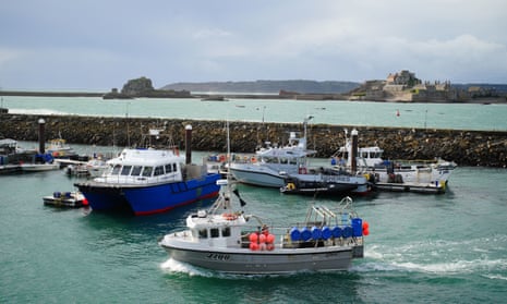 Fishing vessels remain in the harbour at St Helier, Jersey, as talks organised by the European Commission, continued on Monday