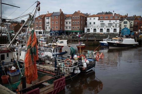 Fishing vessels are pictured moored to the quayside in Whitby, northern England