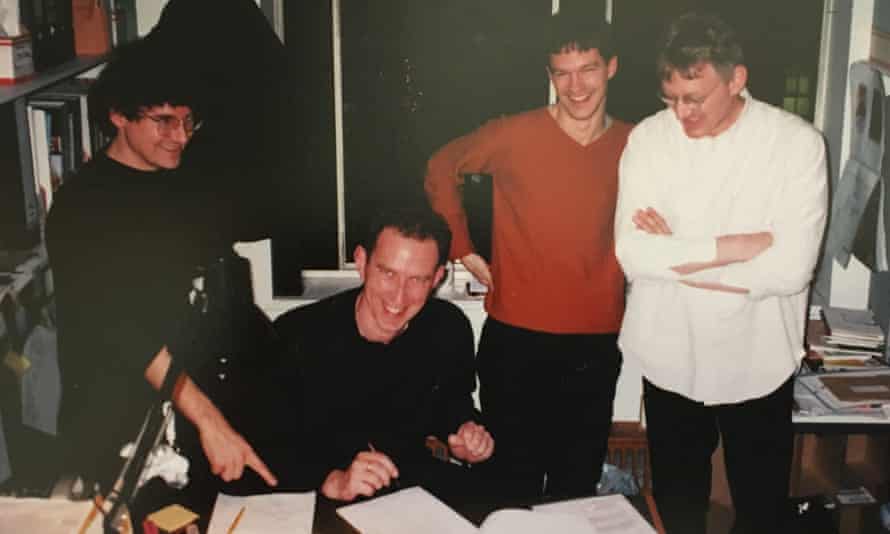 Ben House, Tony Herrington, Rob Young and Chris Bohn in the Wire office, Poland Street, London, 21 December 2000 – Herrington is signing the contracts for the staff buyout of the magazine.