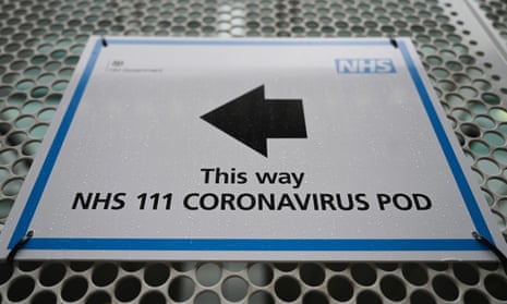 A sign pointing to an NHS coronavirus pod