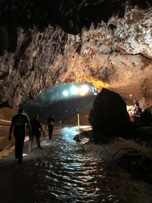 Rescue personnel walk in a cave at the Tham Luang cave complex in a picture tweeted by Elon Musk who arrived at the caves with his mini-submarine. He left it at the site, but the rescue chief has said it’s not of any use for this type of operation