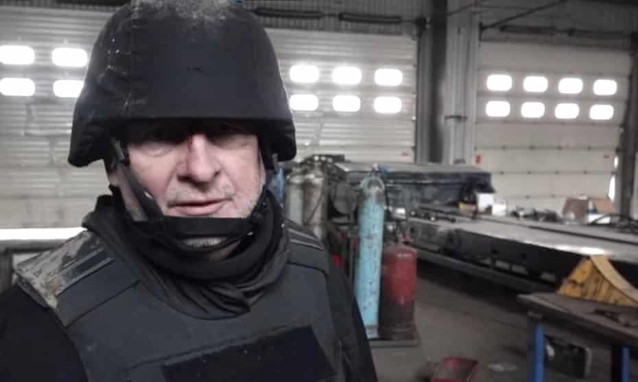 Sky news correspondent Stuart Ramsay in helmet and flak jacket