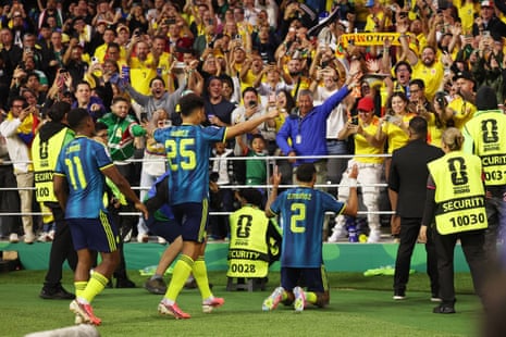 Munoz celebrates in front of the Colombia fans