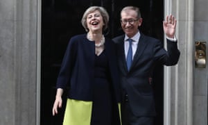 Theresa May and her husband, Philip, enter Downing Street