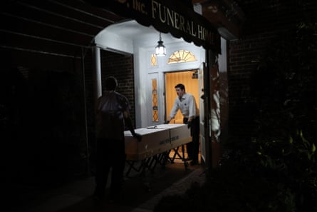 Omar Rodriguez and Joseph Neufeld Jr work at a funeral home in Queens, New York City.