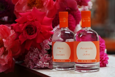Specialised bottles of gin are prepared for the brides and grooms attending a ShotGin wedding at Unexpected Guest Distillery in Marrickville.
