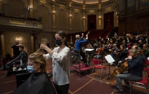 People get a haircut during a rehearsal at the Concertgebouw in Amsterdam.