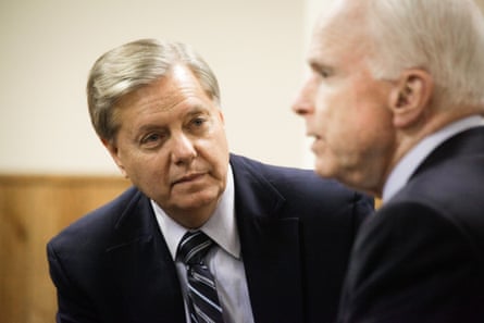 a man looks at another man