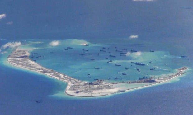 Image from a United States navy video purportedly shows Chinese dredging vessels in the waters around Mischief Reef in the disputed Spratly Islands.