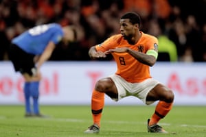 Georginio Wijnaldum celebrates scoring against Estonia.