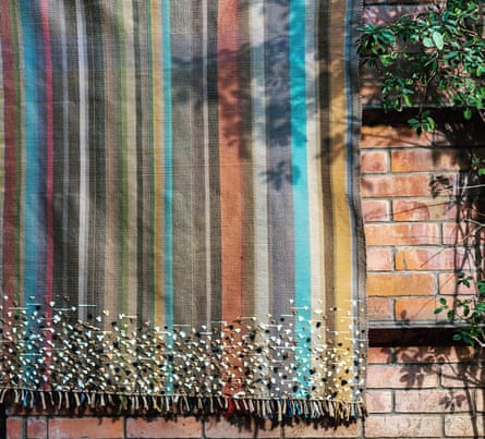 A striped tassled rug in muted shades
