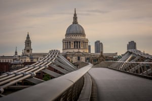 The deserted Millennium Bridge in front of St. Paul’s cathedral. The footbridge opened in June 2000 and was crossed by 90,000 people on that first day