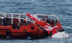 Indonesian search and rescue personnel recover wreckage from AirAsia flight QZ8501.