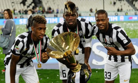 Paul Pogba holds the trophy after Juventus’s 2015 Serie A triumph, next to Kingsley Coman and Patrice Evra