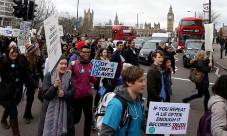 Protesters cross Westminster Bridge outside St Thomas’ hospital in London