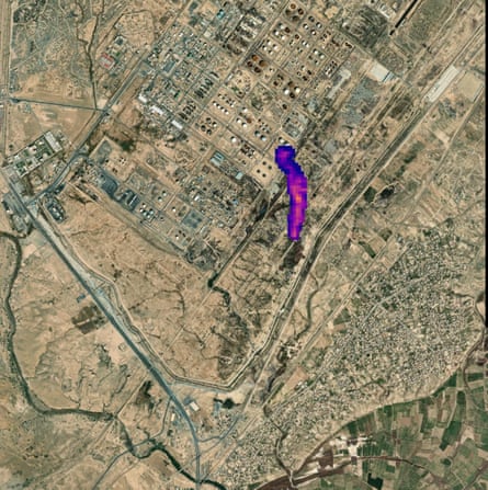 A satellite image of a rural area with a purple and pink pixellated area indicating a plume of methane emissions