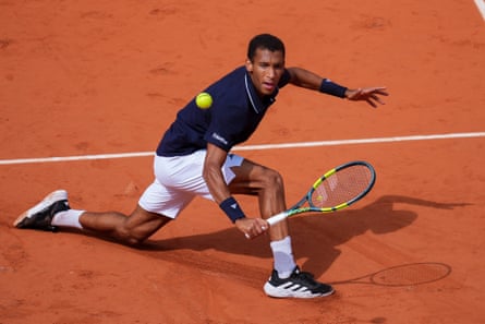 Felix Auger-Aliassime of Canada plays a volley against Flavio Cobolli of Italy during their Men's Singles quarter-final match