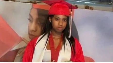 Nikyra Dedeaux is pictured in a red graduation gown and mortarboard.