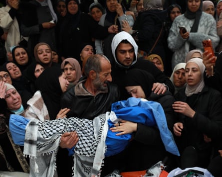 Palestinians mourn at a funeral for the family in the West Bank town of Tammun.